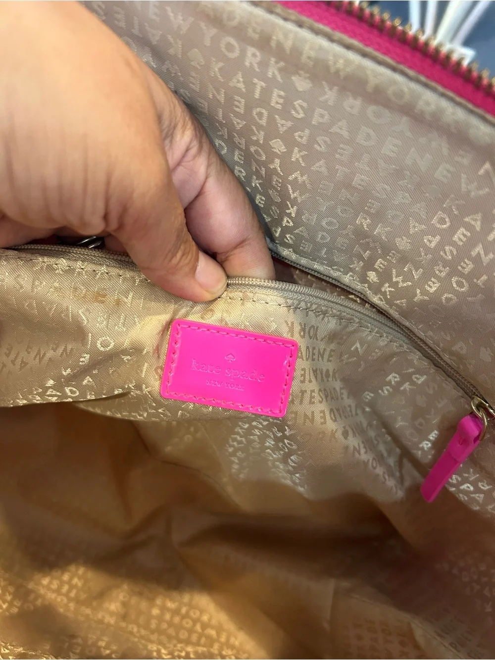 kate spade camellia st Sophie Tote in Hot Pink has a few marks scuffs peeling